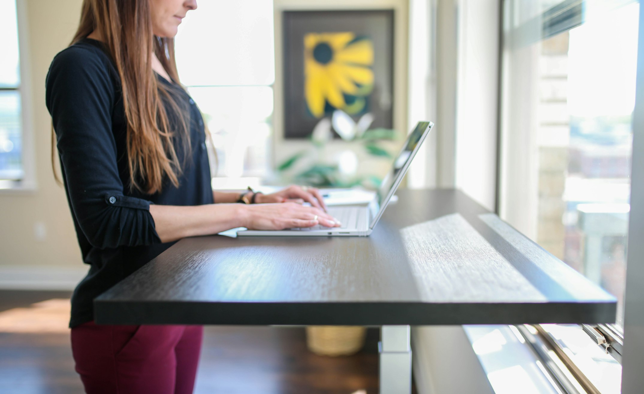 Creative professional brainstorming at standing desk with improved blood flow and cognitive function